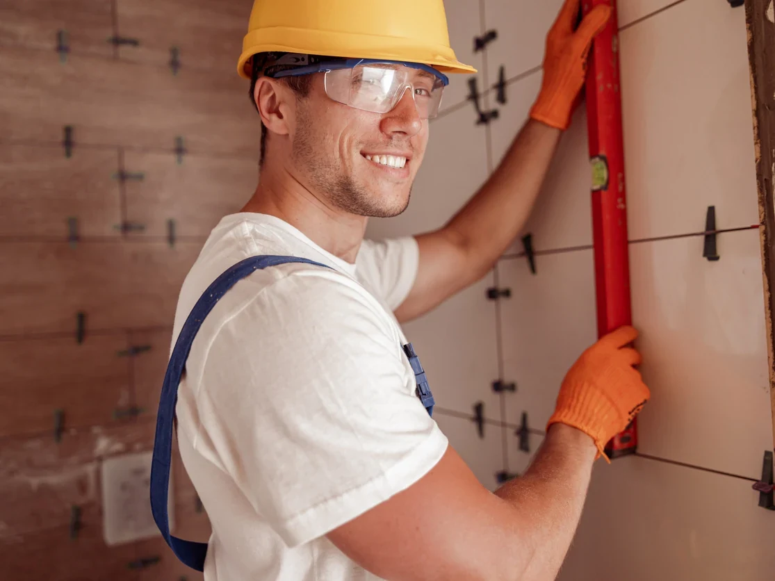 professional tiler measuring tile installation daffodil tiling